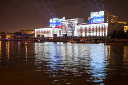 Russia. Moscow - September 26, 2015. The opening of the Festival Circle Of Light. Gorkiy Park. The complex of buildings of the Ministry of Defense and the Andreevskiy Bridge during the Show.のeditorial素材