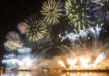 Russia. Moscow - September 26, 2015. The opening of the festival Circle Of Light 2015. Gorkiy Park. View of the complex of buildings of the Ministry of Defense during the show. Salute. Fireworks.のeditorial素材