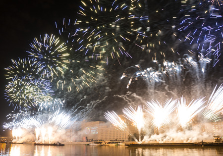 Russia. Moscow - September 26, 2015. The opening of the festival Circle Of Light 2015. Gorkiy Park. View of the complex of buildings of the Ministry of Defense during the show. Salute. Fireworks.のeditorial素材