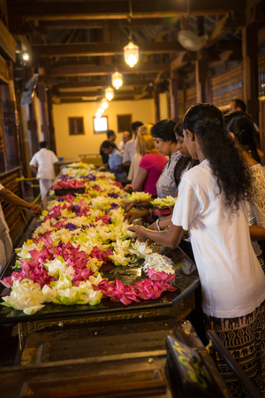 Sri Lanka. Kandy - August 16, 2015. The Tooth of Buddah Temple The Temple of the Tooth Relic. Territory Of The Temple. The inside view. People bring flowers to the Temple.のeditorial素材