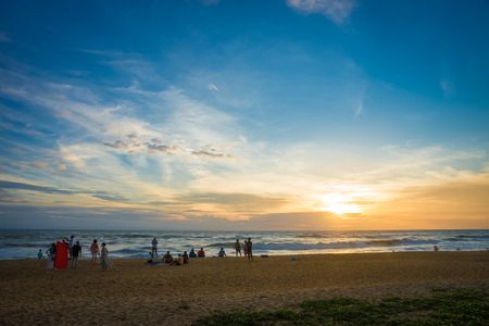 Sri Lanka. Kalutara - August 18, 2015. The Coast Of The Indian Ocean. The beach. People on the beach are watching the sunset over the Ocean.のeditorial素材