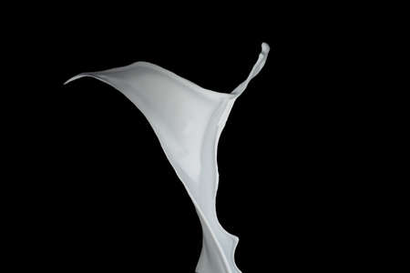 White paint splash isolated on black background.の写真素材