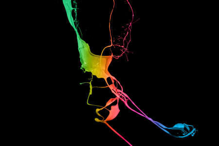 Colored paint splashes isolated on black background