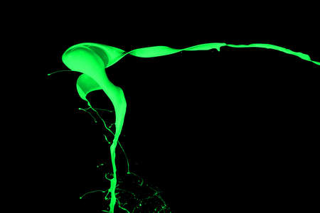 Green paint splash isolated on black  background.