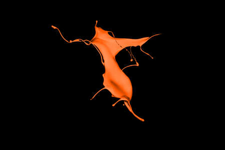 Orange paint splash isolated on black background.の写真素材