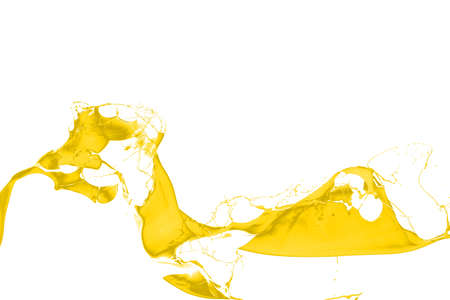 Yellow paint splash isolated on white background.の写真素材