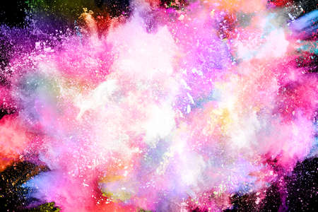 abstract colored dust explosion on a black background.abstract powder splatted background,Freeze motion of color powder exploding/throwing color powder, multicolored glitter texture.の写真素材