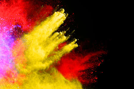 abstract colored dust explosion on a black background.abstract powder splatted background,Freeze...