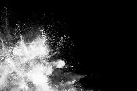 White powder explosion on black background. Colored cloud. Colorful dust explode. Paint Holi.