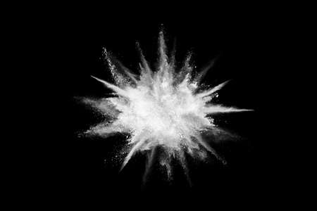White powder explosion on black background. Colored cloud. Colorful dust explode. Paint Holi.