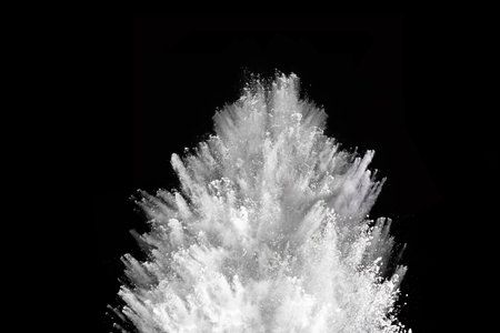 White powder explosion on black background. Colored cloud. Colorful dust explode. Paint Holi.