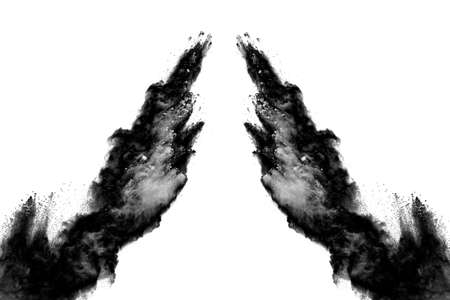 particles of charcoal on white background,abstract powder splatted on white background,Freeze motion of black powder exploding or throwing black powder.の写真素材