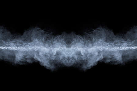 White powder explosion on black background. Colored cloud. Colorful dust explode. Paint Holi.の写真素材