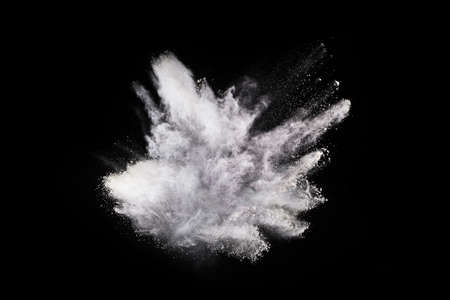 White powder explosion on black background. Colored cloud. Colorful dust explode. Paint Holi.