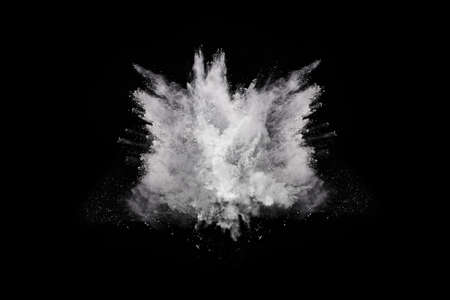 White powder explosion on black background. Colored cloud. Colorful dust explode. Paint Holi.