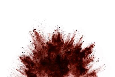 Brown color powder explosion on white background. Colored cloud. Colorful dust explode. Paint Holi.