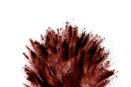 Brown color powder explosion on white background. Colored cloud. Colorful dust explode. Paint Holi.の写真素材