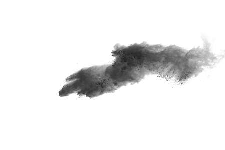 particles of charcoal on white background,abstract powder splatted on white background,Freeze motion of black powder exploding or throwing black powder.の写真素材