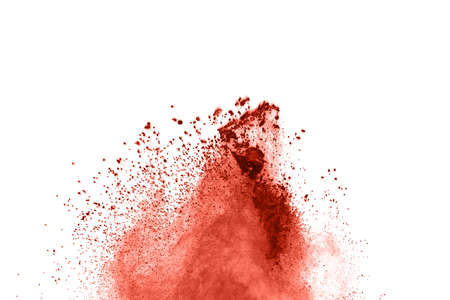 living coral color powder explosion on white background. Colored cloud. Colorful dust explode. Paint...