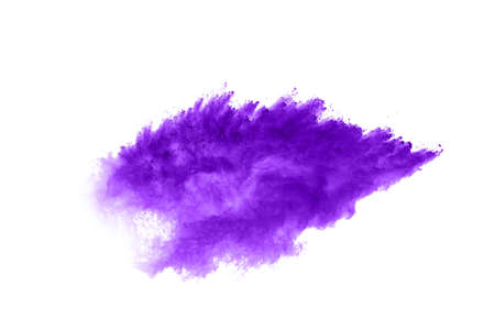 Powder explosion. Closeup of a purple dust particle explosion isolated on white. Abstract background.の写真素材
