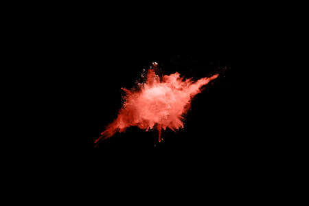 Abstract living coral powder splatted background,Freeze motion of color powder exploding/throwing...