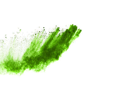 Green powder explosion on white background. Colored cloud. Colorful dust explode. Paint Holi.の写真素材