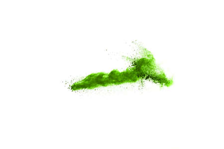 Green powder explosion on white background. Colored cloud. Colorful dust explode. Paint Holi.の写真素材