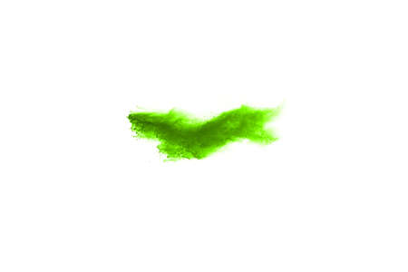 Green powder explosion on white background. Colored cloud. Colorful dust explode. Paint Holi.の写真素材