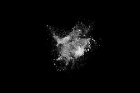 White powder explosion on black background. Colored cloud. Colorful dust explode. Paint Holi.の写真素材