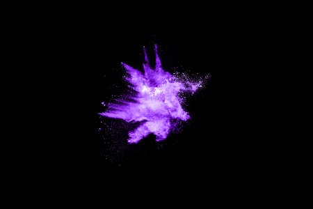 The movement of abstract dust explosion frozen purple on black background. Stop the movement of...