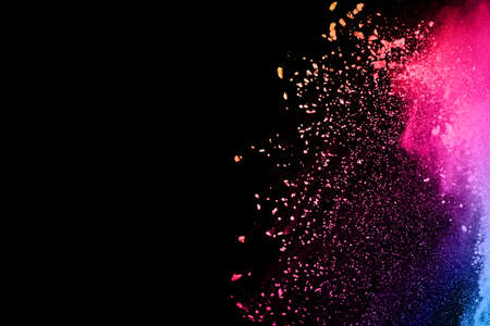 abstract red powder explosion on black background.abstract red powder splatted on black background....