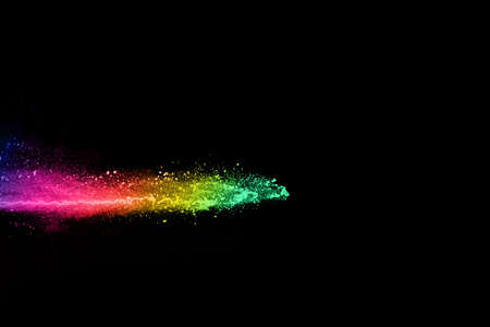 abstract colored dust explosion on a black background.abstract powder splatted background,Freeze...