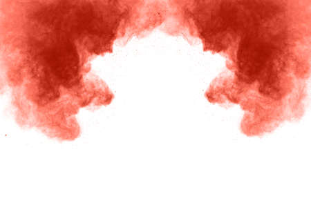 living coral color powder explosion on white background. Colored cloud. Colorful dust explode. Paint...