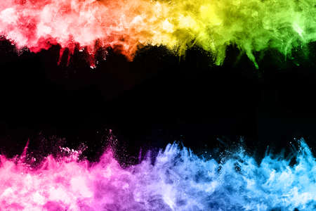 abstract colored dust explosion on a black background.abstract powder splatted background,Freeze...