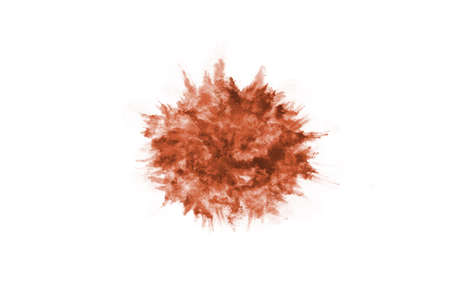 Brown color powder explosion on white background. Colored cloud. Colorful dust explode. Paint Holi.