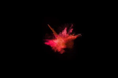 Abstract red powder explosion on black background.abstract red powder splatted on black background....