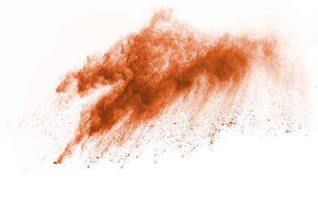 Brown color powder explosion on white background. Colored cloud. Colorful dust explode. Paint Holi.の写真素材