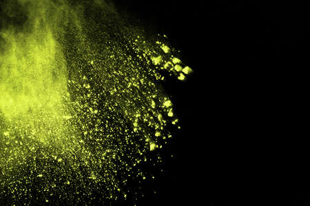 The movement of abstract dust explosion frozen green on black background. Stop the movement of...