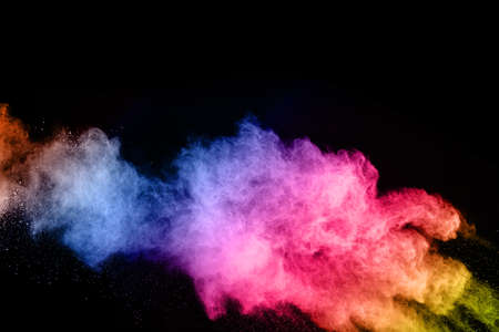 abstract colored dust explosion on a black background.abstract powder splatted background,Freeze...