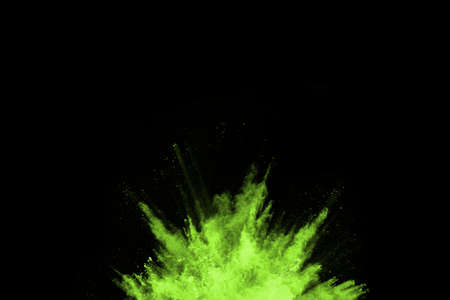 The movement of abstract dust explosion frozen green on black background. Stop the movement of...