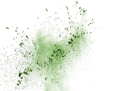 Green powder explosion on white background. Colored cloud. Colorful dust explode. Paint Holi.の写真素材