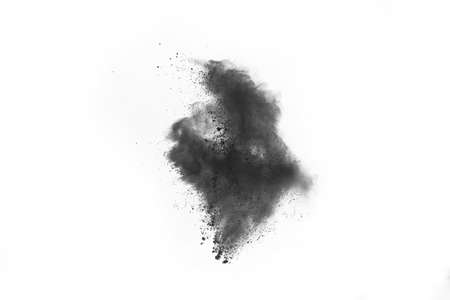 Particles of charcoal on white background,abstract powder splatted on white background,Freeze motion...
