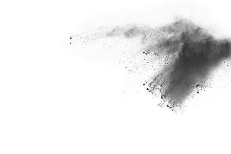Particles of charcoal on white background,abstract powder splatted on white background,Freeze motion of black powder exploding or throwing black powder.の写真素材