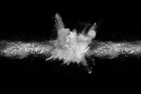 White powder explosion on black background. Colored cloud. Colorful dust explode. Paint Holi.