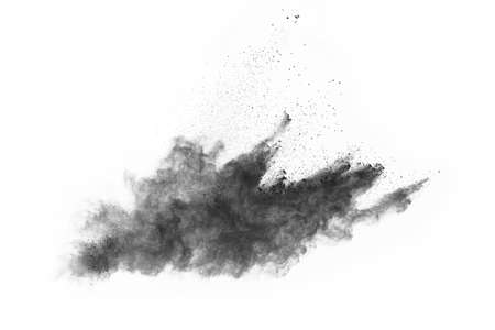Particles of charcoal on white background,abstract powder splatted on white background,Freeze motion...