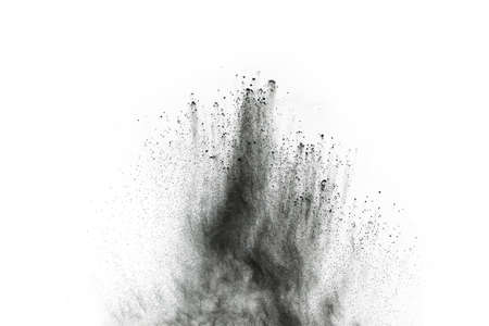 particles of charcoal on white background,abstract powder splatted on white background,Freeze motion...