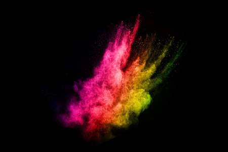 abstract colored dust explosion on a black background.abstract powder splatted background,Freeze...