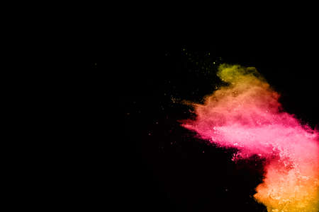 abstract colored dust explosion on a black background.abstract powder splatted background,Freeze...