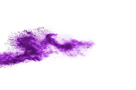 Powder explosion. Closeup of a purple dust particle explosion isolated on white. Abstract...