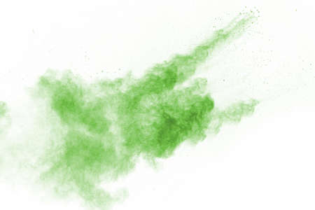 Green powder explosion on white background. Colored cloud. Colorful dust explode. Paint Holi